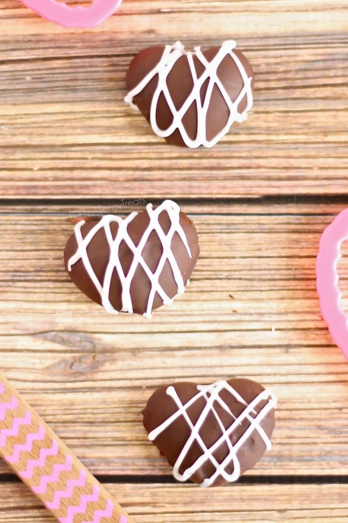 Chocolate Raspberry Cookie Dough Truffles (gluten free Vegan raw) Chocolate covered raspberry flavored cookie dough. A no bake natural red treat. 